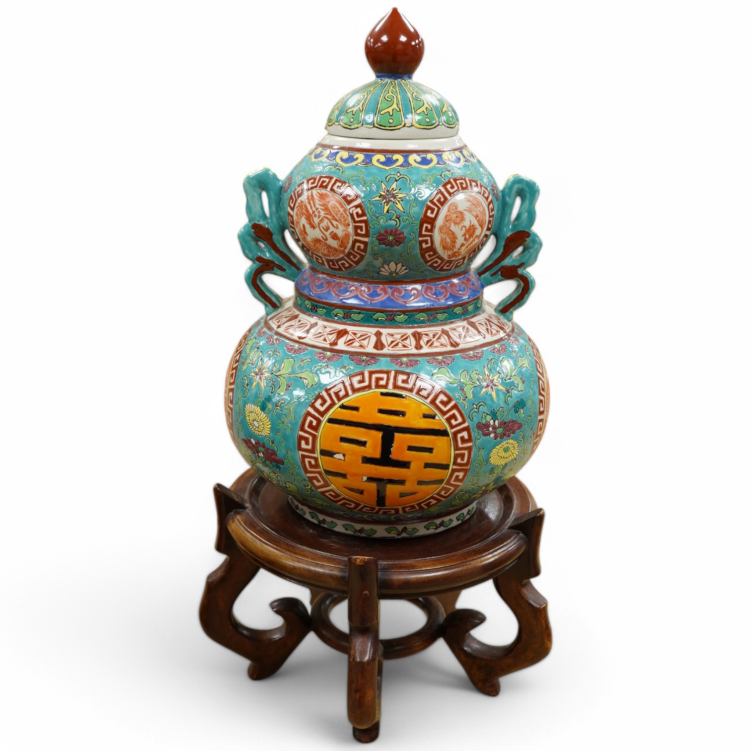 A Chinese double-gourd vase and cover, on associated hardwood stand, total height 65cm. Condition - fair to good